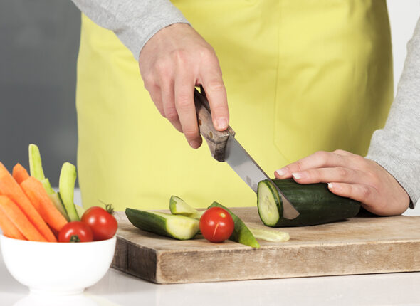 Woman cutting vegetables